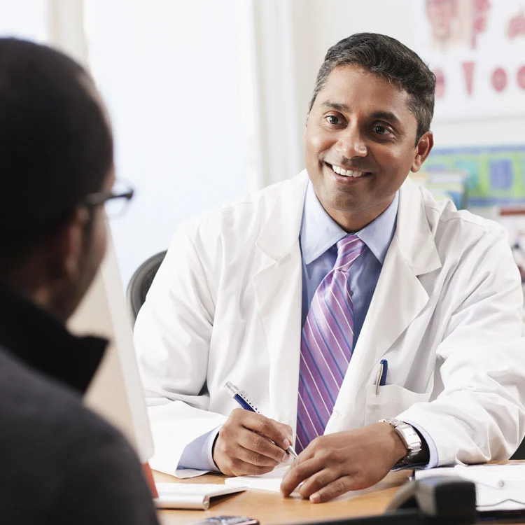 Image of a doctor speaking to a patient